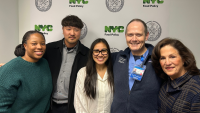 A photo of Columbia Nursing students in front of an NYC Food Policy Sign